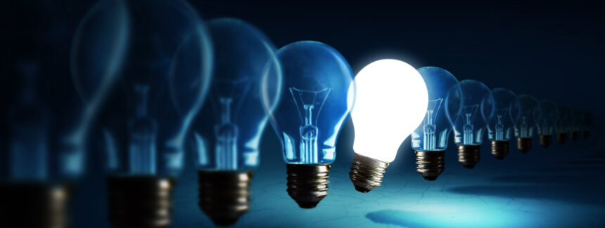 Innovation Lightbulbs on blue background, idea concept